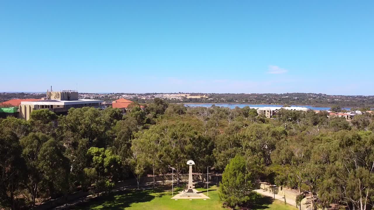 Aerial rise up over Central Park, to reveal Joondalup Lake in background - Perth