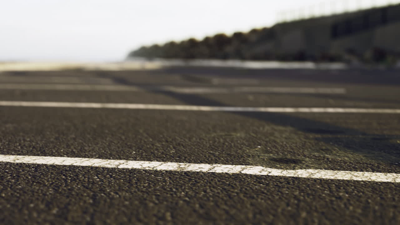 Coastal promenade showcasing sunlit asphalt and tranquil beachside vibes