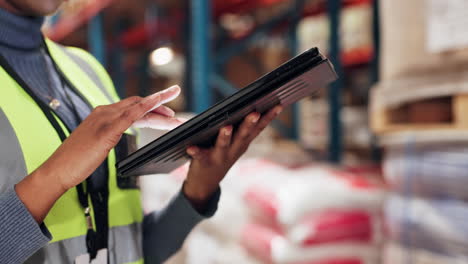 woman using a tablet in a warehouse