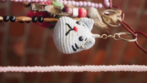 handmade crochet cat keychain and jewelry display