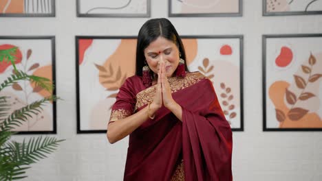 indian woman doing namaste and greetings