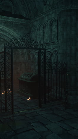 a dark and eerie crypt with a tomb and candles