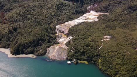 panoramic view on orakei korako geothermal area, a tourist attraction in the taupo volcanic zone, new zealand - aerial drone shot