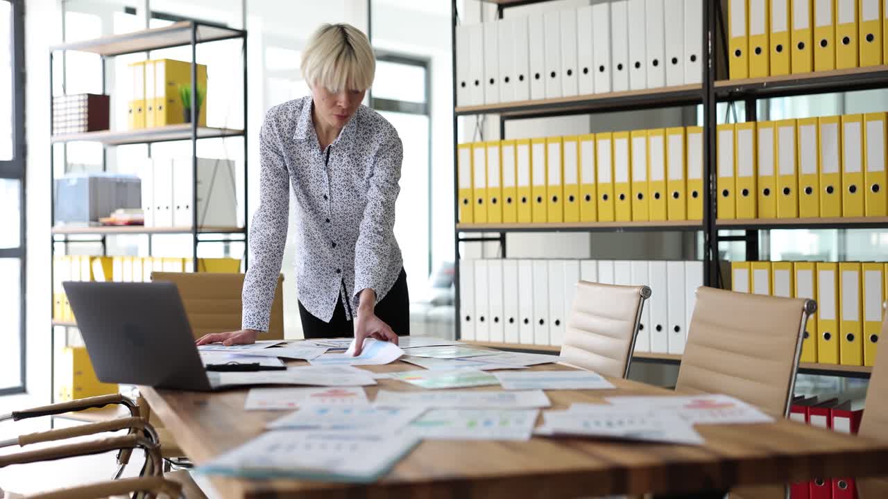 Woman working on paperwork at office
