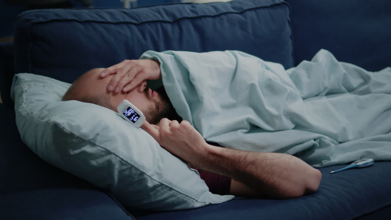 Close up of adult using oximeter for disease diagnosis