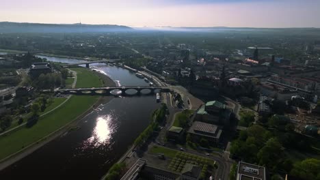 Dresden-aerial-establisher-shot,-bridged-crossing-Elbe-river,-Germany,-sunny-day