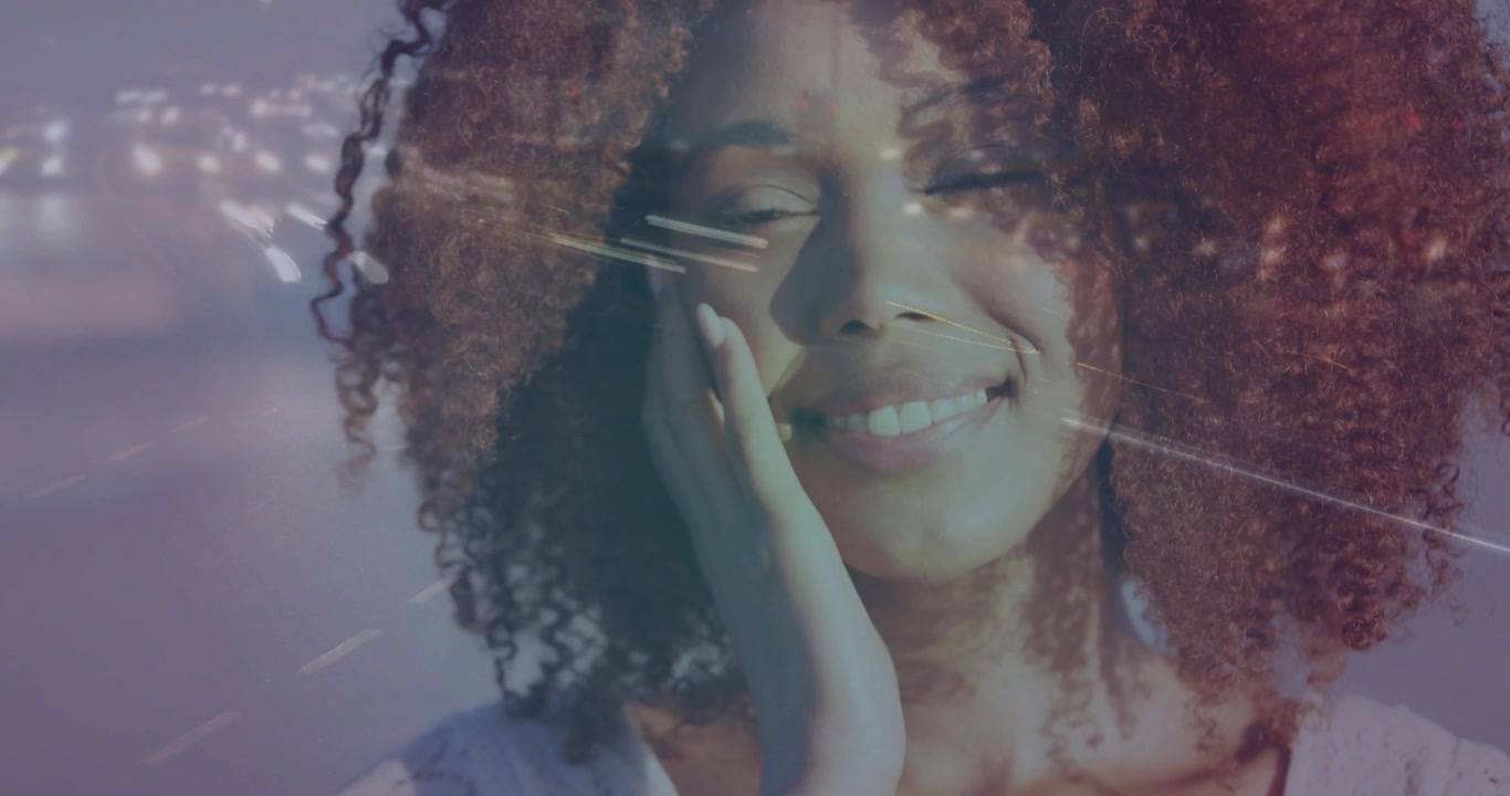 Female model holding hand to cheek, reacting to horizontal light streaks, smiling for beauty ad