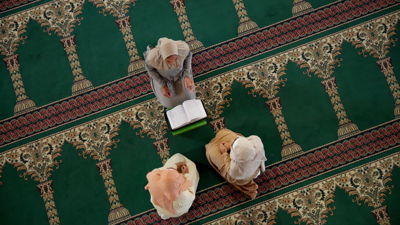 Muslim women praying in a mosque