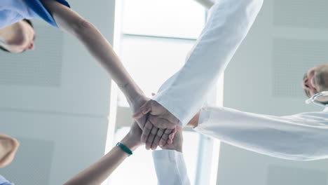 medical, team and doctors hands stack for support