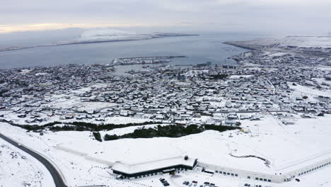 4k slow orbit of tórshavn town covered in snow, faroe islands