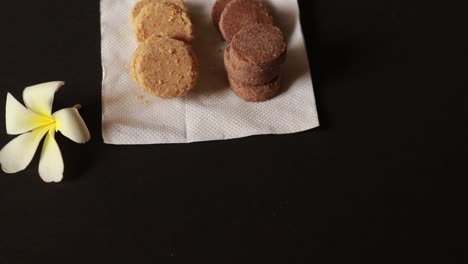 biscuits and ginger breads on a conveyor belt in a bakery