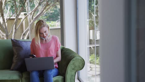 woman using laptop at home