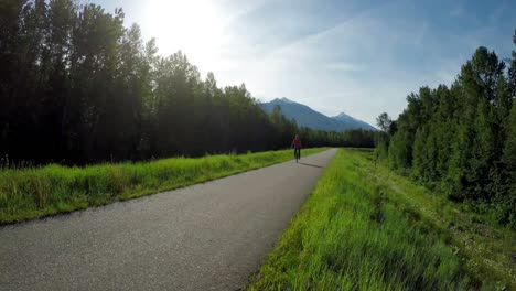 woman riding unicycle on road 4k