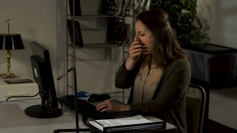 female office worker working late, typing, yawning, stretching-2