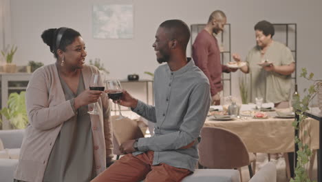 group of african american friends enjoying dinner party