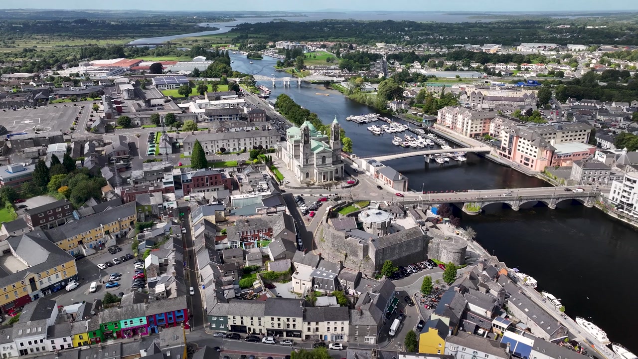Athlone town, drone reveal from church building and old town on riverside. Ireland