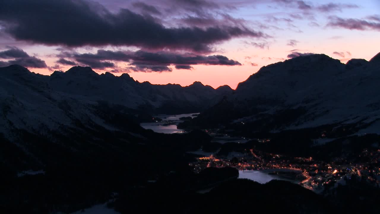 Beautiful time lapse shot of sunset behind a mountain town 2