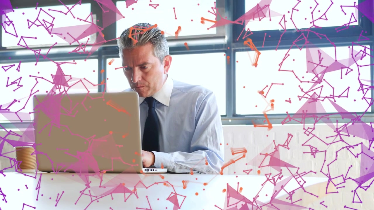 Businessman pausing typing, drinking from cup while focusing, purple particles drifting over laptop
