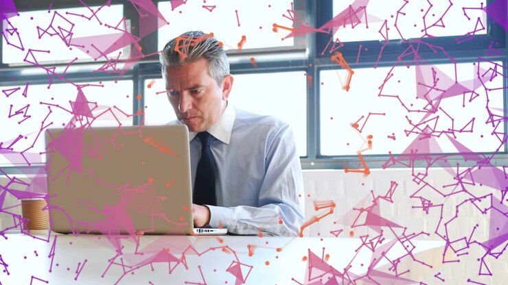 Businessman pausing typing, drinking from cup while focusing, purple particles drifting over laptop