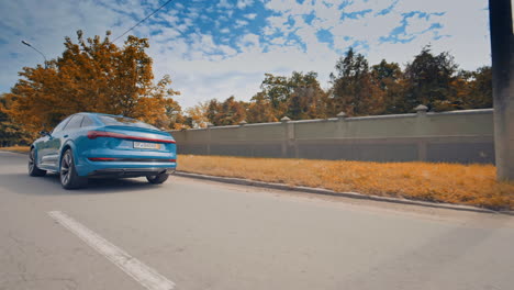 Electric metallic blue Audi e-tron 55 quattro SUV. Audi e tron, a fully electric car on highway