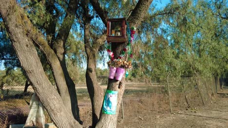 Devotion-on-a-tree-in-the-shape-of-little-catholic-things,-a-warm-reminder-of-the-faith