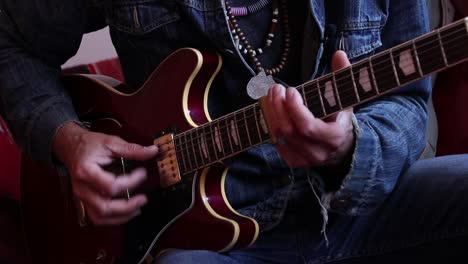 guitar being played by rock musician