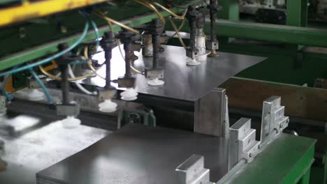 automatical manipulator moving metal sheet. production household appliances