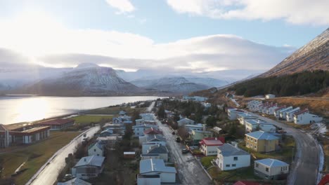 amazing drone flying over mountain landscape at sea, fjords and arctic scenery in westfjords of iceland - aerial shot