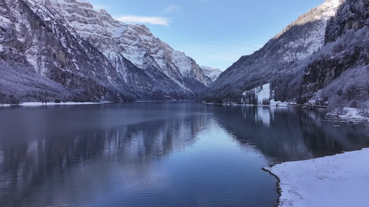 Aerial view of the alpine Lake Klöntalersee, located in the Canton of Glarus, Switzerland, surrounded by breathtaking mountain scenery.