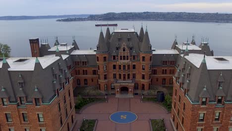 drone shot of stadium high school that starts on the commencement bay and zooms out to reveal the historic campus.