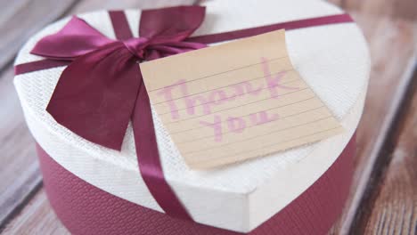 heart-shaped gift box with thank you note