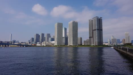 toyosu park in tokyo on clear sunny day in japan, slow motion establishing shot