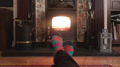 warming feet in front of a real fireplace