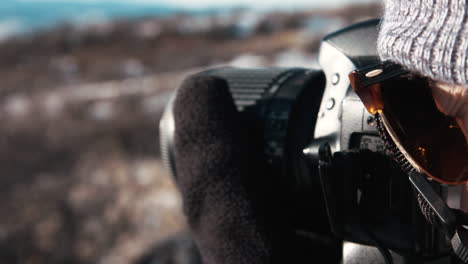 Person-using-Camera-in-the-snow