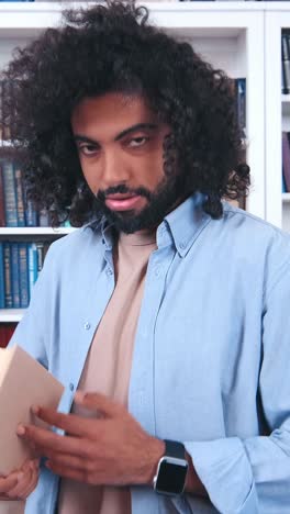 a man explores ancient texts in a quiet library during a cozy afternoon