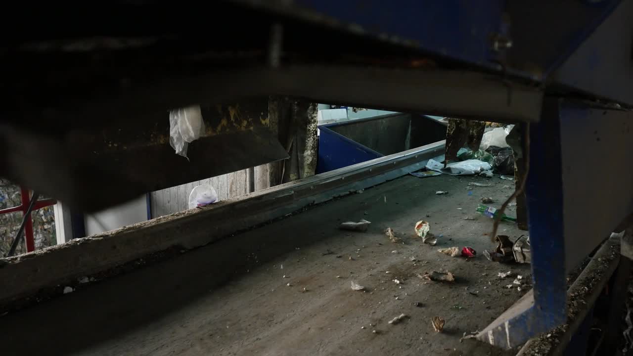 Garbage falling onto a conveyor belt