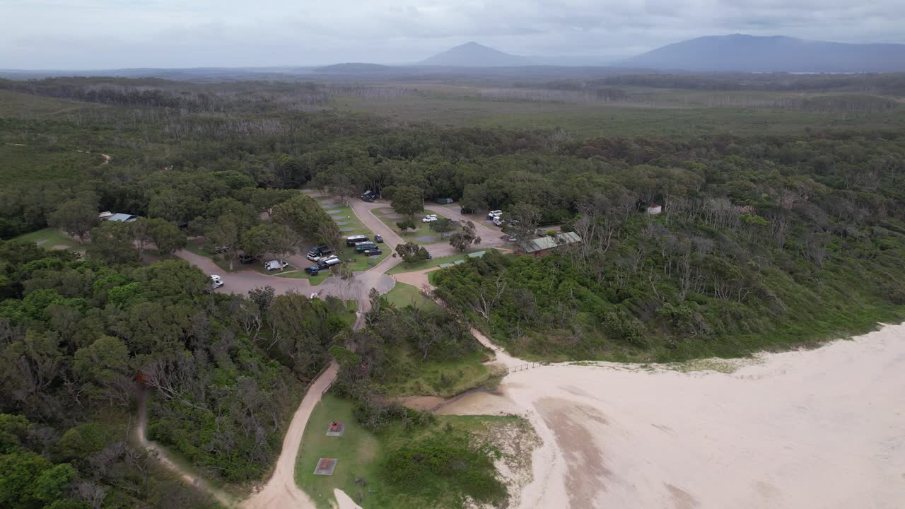 Sandy Coastline With Greenery At Diamond Head Beach In Barrington Coast, NSW, Australia. aerial shot