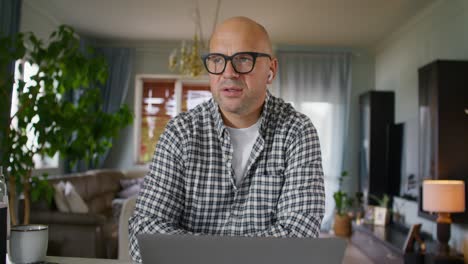 man in video conference call at home