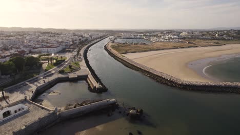 Aerial-approaching-Bensafrim-River-mouth,-Lagos,-Algarve