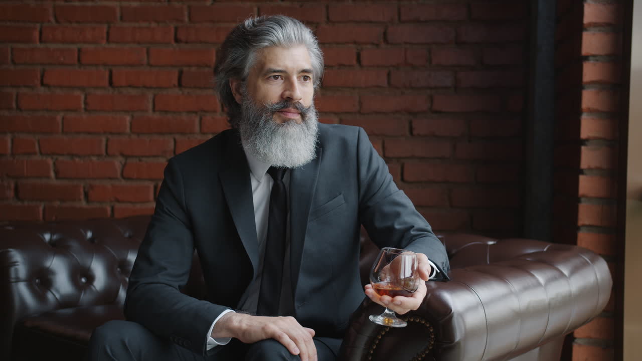 Thoughtful Businessman Enjoying a Drink