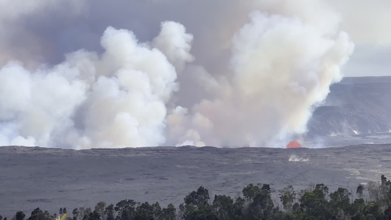 Cinematic long lens booming up shot from Volcano House of Kilauea erupting in the afternoon of its first day of activity in September 2023 on the Big Island of Hawai'i