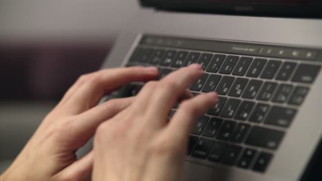 female hands typing on laptop keyboard. professional using notebook keypad