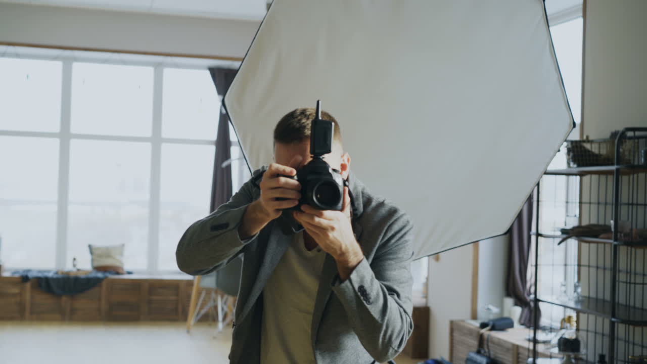 Photographer taking photos in a studio