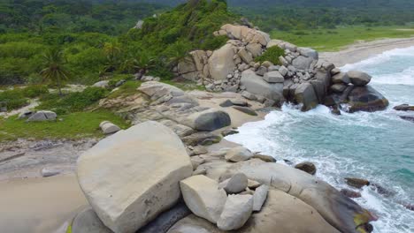 Tropical-exotic-secluded-beach-in-Santa-Marta,-Colombia-near-dense-forest