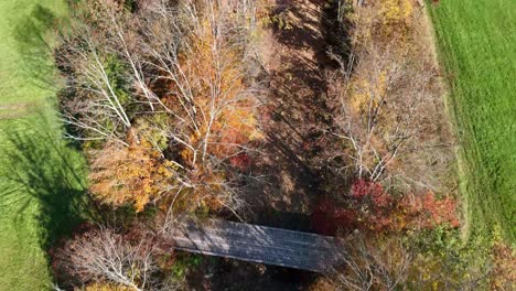 aerial over creek in fall near reading vermont