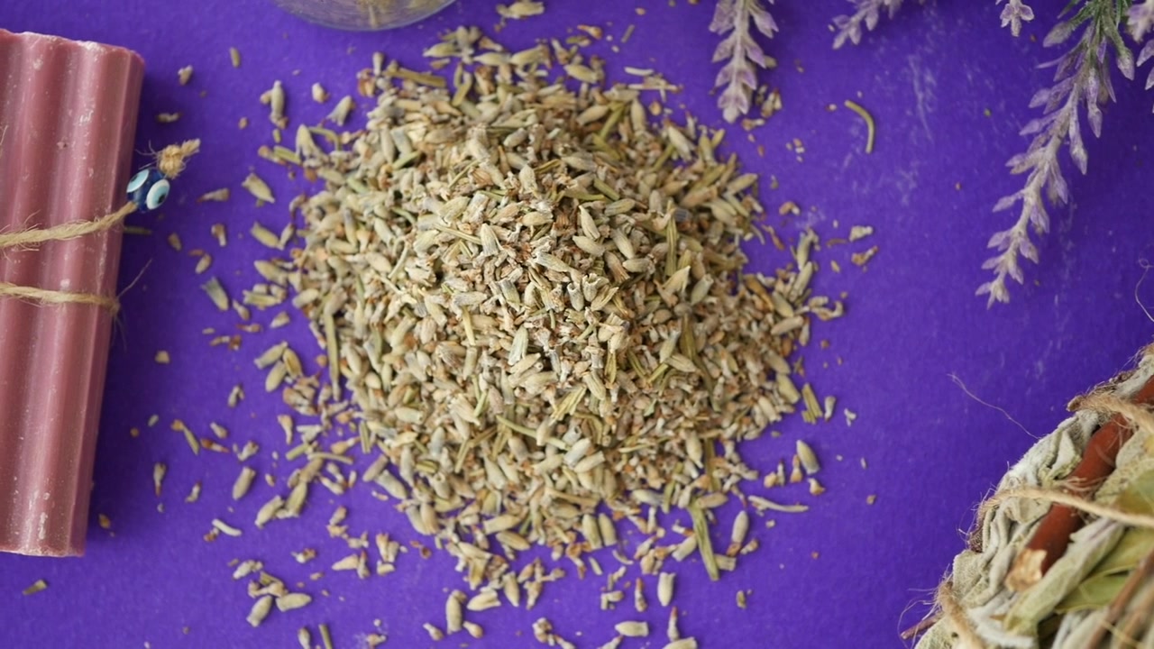 Pile of Dried Fennel Seeds on Purple Background