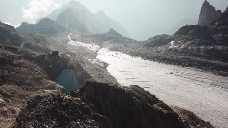 rocky mountains on top of the swiss alps, glacier, alpine lake, sunrise. cabane orny