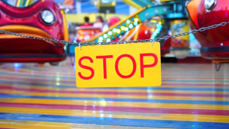 stop sign with carnival festival blurred carousel background