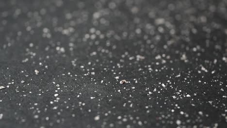 close-up of salt on a dark surface