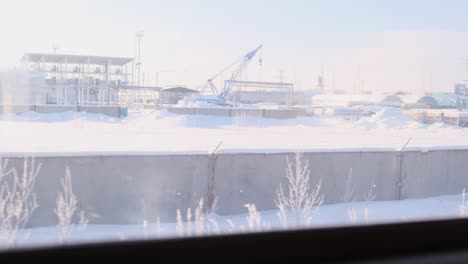 industrial base from the window of a moving train